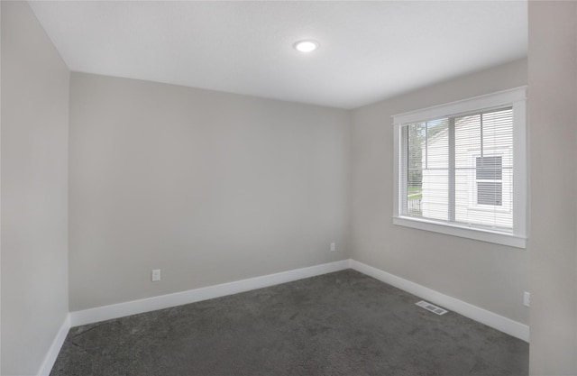 501 Kirkwood Ave, Des Moines, IA 50315 - empty room with dark carpet, baseboards, and recessed lighting