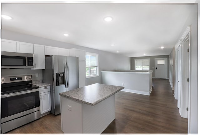 501 Kirkwood Ave, Des Moines, IA 50315 - kitchen featuring stainless steel appliances, a center island, dark wood-style flooring, healthy amount of natural light, and recessed lighting