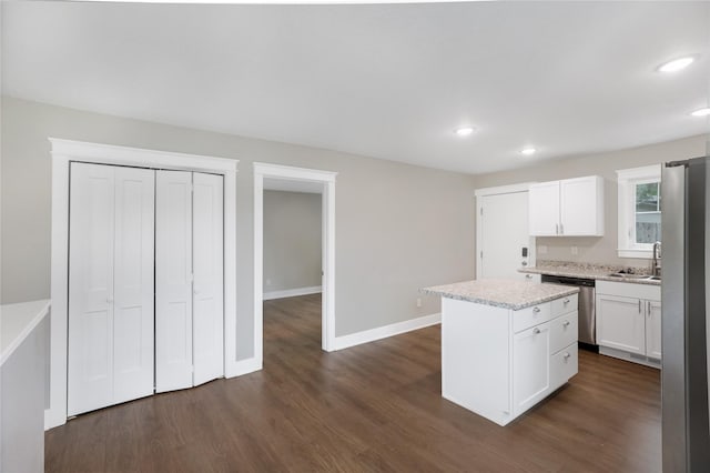 501 Kirkwood Ave, Des Moines, IA 50315 - kitchen featuring stainless steel appliances, a center island, recessed lighting, white cabinets, and dark wood-type flooring