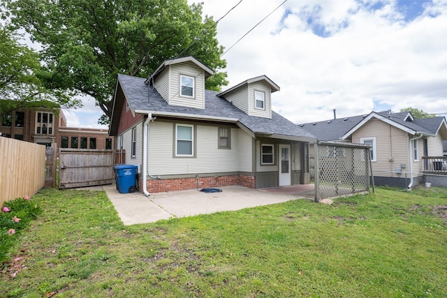 3416 Cambridge St, Des Moines, IA 50313 - back of property featuring a patio area, a gate, and a shingled roof