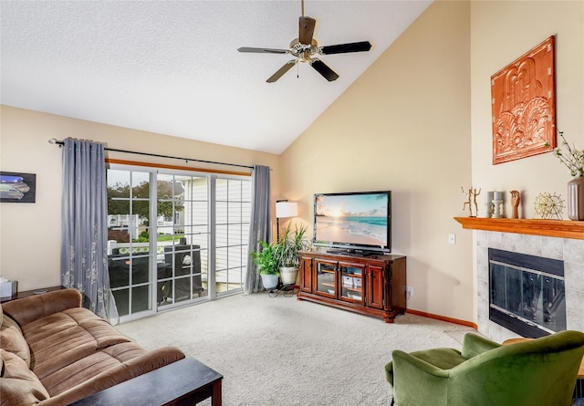 2816 Ashland Ct, Altoona, IA 50009 - living room with carpet, a ceiling fan, high vaulted ceiling, and a tile fireplace