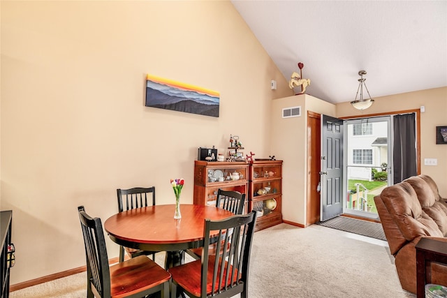 2816 Ashland Ct, Altoona, IA 50009 - dining space featuring light colored carpet and lofted ceiling