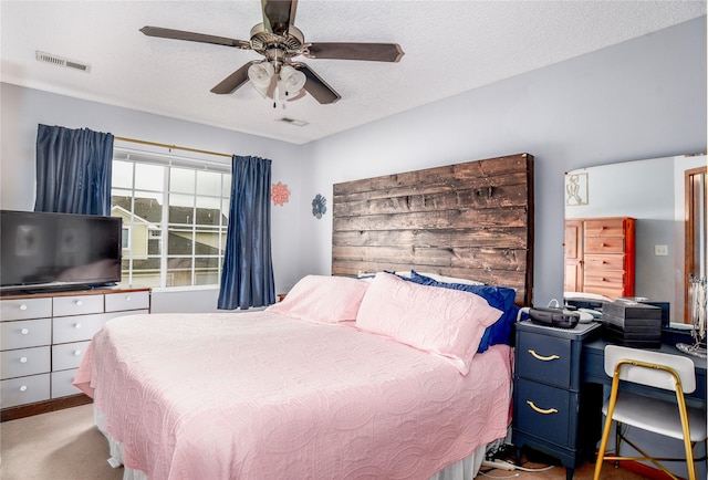 2816 Ashland Ct, Altoona, IA 50009 - bedroom featuring a ceiling fan, a textured ceiling, and carpet floors