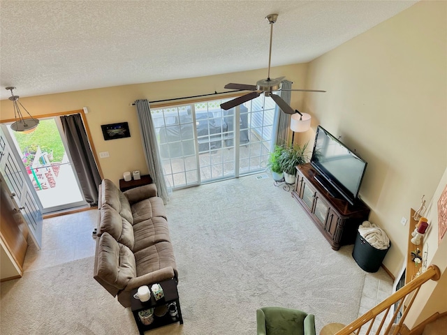 2816 Ashland Ct, Altoona, IA 50009 - living area with carpet, ceiling fan, a textured ceiling, and lofted ceiling