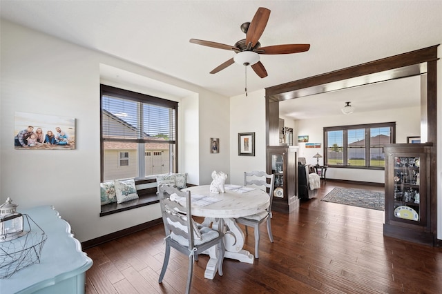7305 NW 18th St, Ankeny, IA 50023 - dining room with dark wood-style floors, a ceiling fan, and baseboards