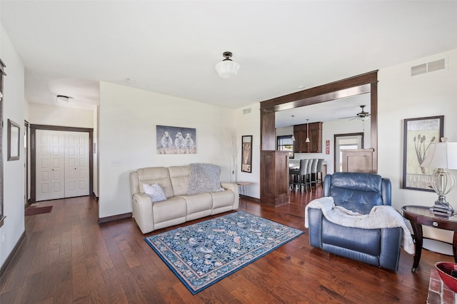 7305 NW 18th St, Ankeny, IA 50023 - living area featuring wood-type flooring, ceiling fan, and baseboards