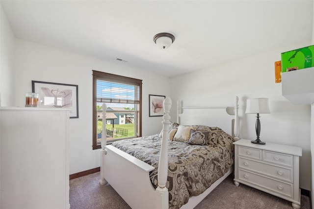 7305 NW 18th St, Ankeny, IA 50023 - bedroom featuring dark colored carpet and baseboards