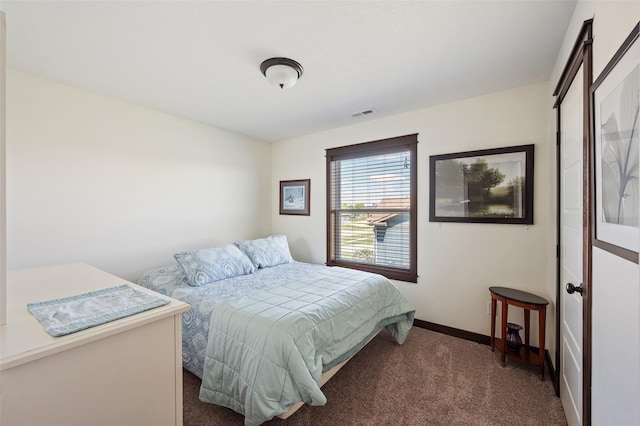 7305 NW 18th St, Ankeny, IA 50023 - bedroom featuring dark carpet and baseboards