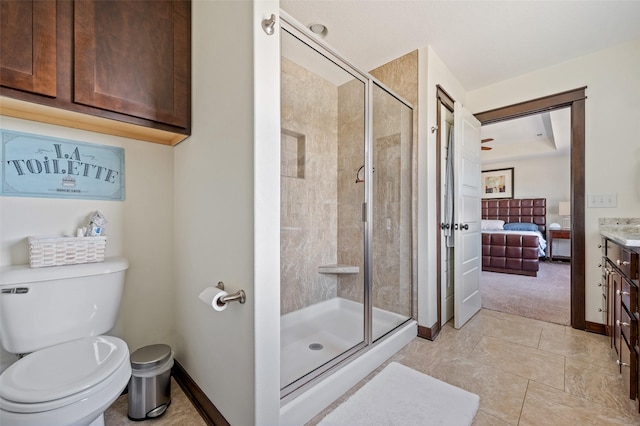 7305 NW 18th St, Ankeny, IA 50023 - ensuite bathroom featuring toilet, a shower stall, vanity, baseboards, and tile patterned floors