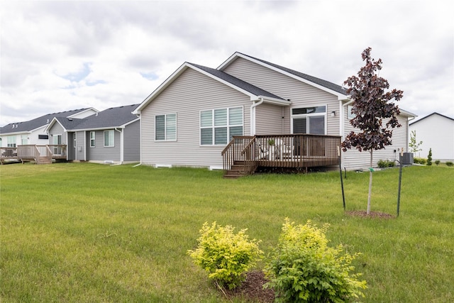 523 NE Vista Ln, Ankeny, IA 50021 - rear view of house with a wooden deck, a yard, and central AC