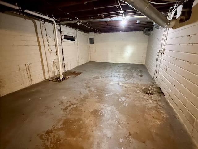 3916 Cambridge St, Des Moines, IA 50313 - unfinished below grade area with electric panel and concrete block wall