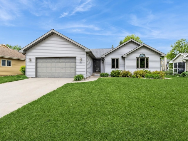 3721 Fletcher Blvd, Ames, IA 50010 - ranch-style house with driveway, a garage, and a front lawn