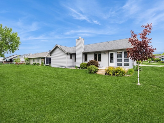 3721 Fletcher Blvd, Ames, IA 50010 - back of house with a lawn, a chimney, and a shingled roof