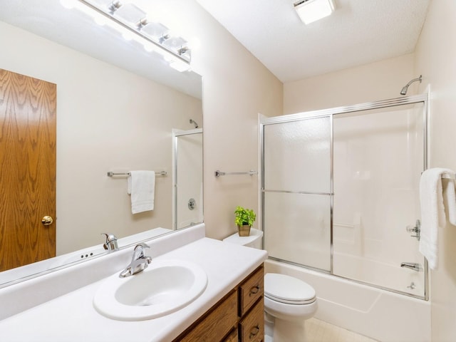 3721 Fletcher Blvd, Ames, IA 50010 - bathroom featuring vanity, toilet, and shower / bath combination with glass door