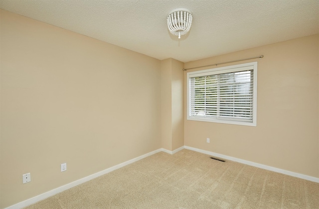 1050 68th St Unit 8, West Des Moines, IA 50266 - spare room with carpet flooring and baseboards