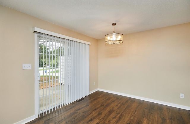 1050 68th St Unit 8, West Des Moines, IA 50266 - empty room with dark wood-style floors, baseboards, and a chandelier