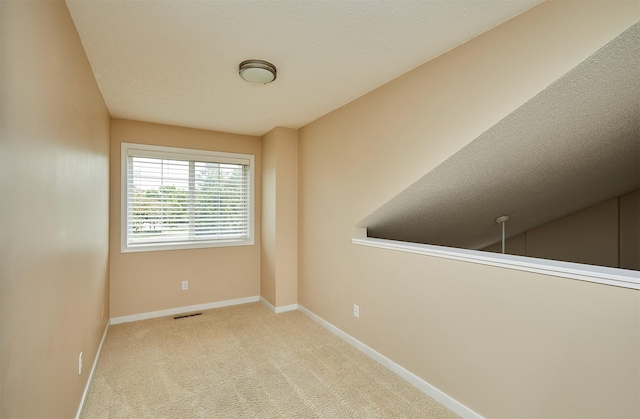1050 68th St Unit 8, West Des Moines, IA 50266 - carpeted spare room featuring baseboards