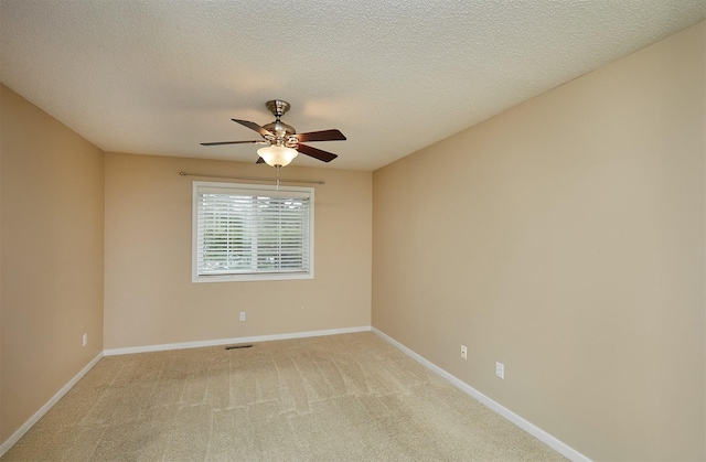 1050 68th St Unit 8, West Des Moines, IA 50266 - unfurnished room with ceiling fan, light colored carpet, baseboards, and a textured ceiling