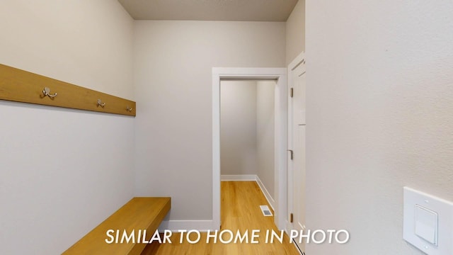 2540 E 50th Ct, Des Moines, IA 50317 - hallway with wood finished floors and baseboards