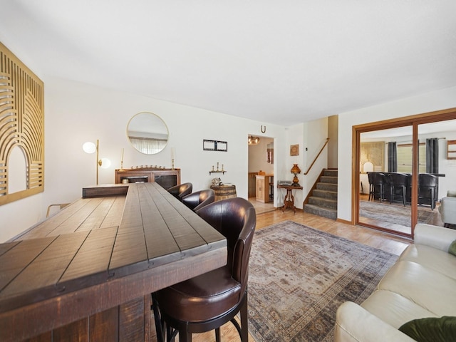 5180 NW 64th Pl, Johnston, IA 50131 - living room featuring stairs and wood finished floors