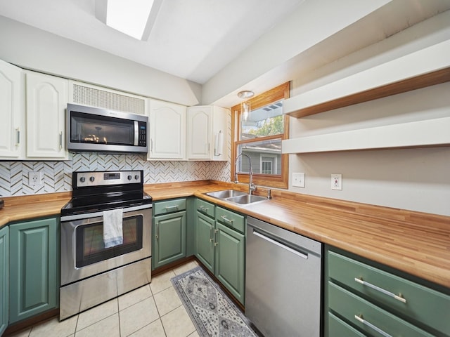 5180 NW 64th Pl, Johnston, IA 50131 - kitchen with appliances with stainless steel finishes, wooden counters, green cabinets, and a sink
