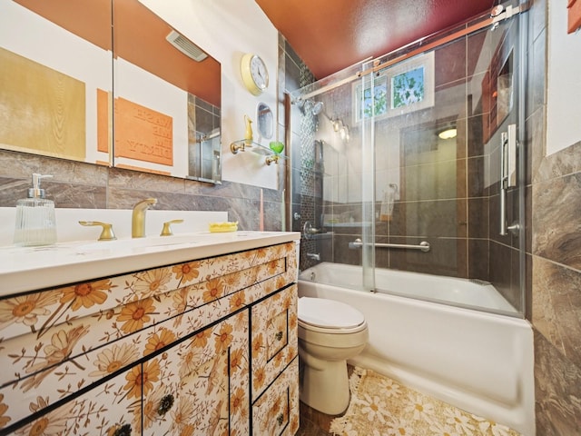 5180 NW 64th Pl, Johnston, IA 50131 - full bathroom featuring toilet, vanity, tile walls, and bath / shower combo with glass door