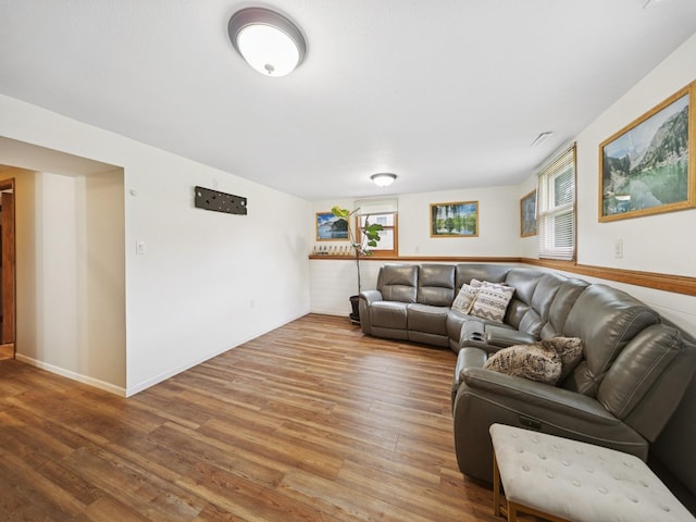 5180 NW 64th Pl, Johnston, IA 50131 - living room with wood finished floors, healthy amount of natural light, and baseboards