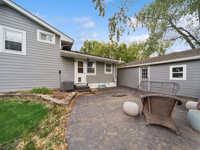 5180 NW 64th Pl, Johnston, IA 50131 - rear view of house featuring entry steps, a patio area, and central AC unit