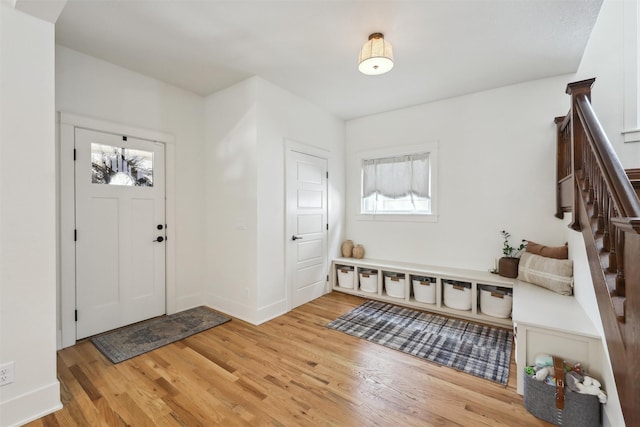 1107 24th St, Des Moines, IA 50311 - entryway with healthy amount of natural light, stairway, and light wood-type flooring