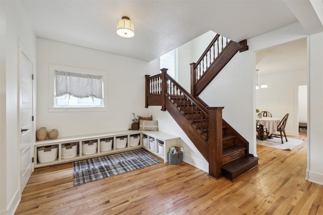 1107 24th St, Des Moines, IA 50311 - foyer featuring stairs and light wood finished floors