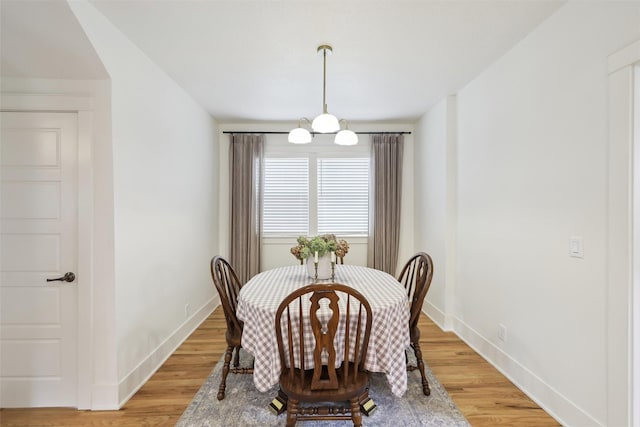 1107 24th St, Des Moines, IA 50311 - dining space featuring baseboards and light wood-style flooring