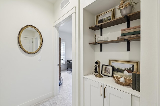1107 24th St, Des Moines, IA 50311 - hallway featuring carpet floors and baseboards