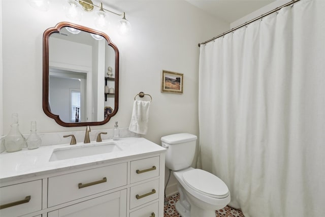 1107 24th St, Des Moines, IA 50311 - full bathroom with toilet, vanity, and tile patterned floors