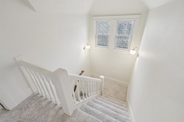 1107 24th St, Des Moines, IA 50311 - staircase featuring carpet floors and baseboards