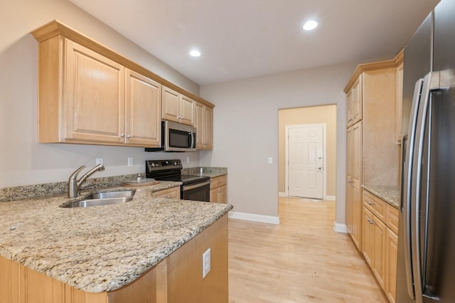 1960 NW 126th St, Clive, IA 50325 - kitchen featuring appliances with stainless steel finishes, a sink, light brown cabinets, baseboards, and light wood-type flooring