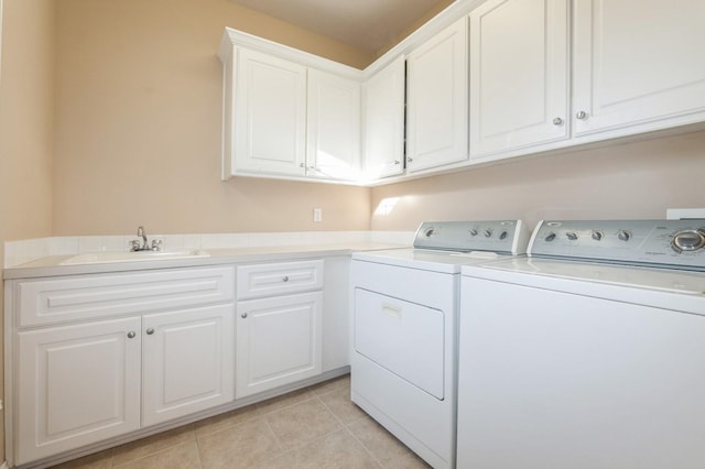 1960 NW 126th St, Clive, IA 50325 - laundry room with washer and clothes dryer, cabinet space, and light tile patterned floors