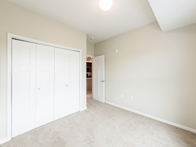 1250 SW Magazine Rd Unit 105, Ankeny, IA 50023 - unfurnished bedroom with carpet floors, a closet, and baseboards