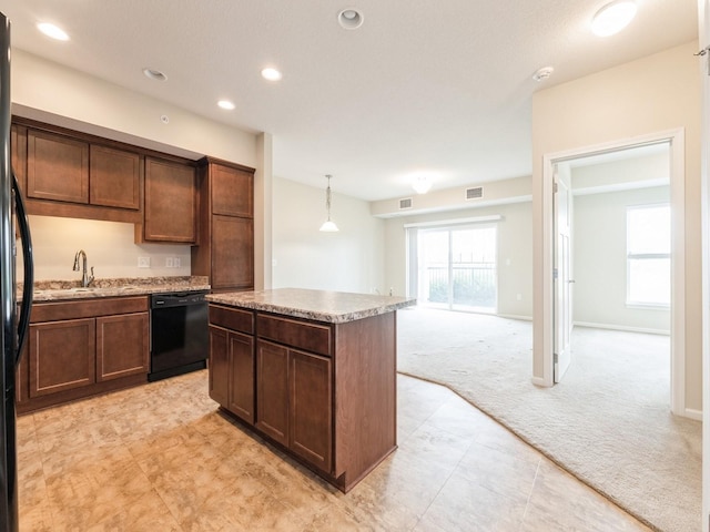 1250 SW Magazine Rd Unit 105, Ankeny, IA 50023 - kitchen featuring black appliances, light colored carpet, a sink, a kitchen island, and recessed lighting