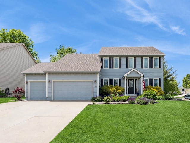 2190 NW 147th St, Clive, IA 50325 - colonial inspired home featuring a garage, driveway, a front lawn, and a shingled roof