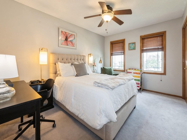 2190 NW 147th St, Clive, IA 50325 - carpeted bedroom featuring baseboards, an office area, and a ceiling fan