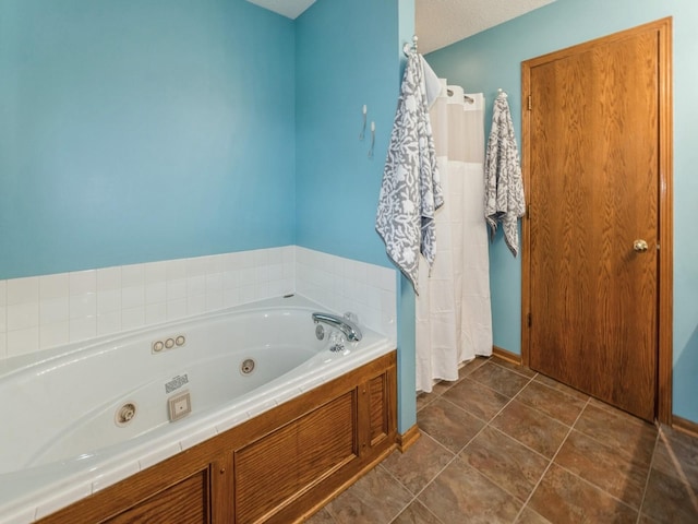 2190 NW 147th St, Clive, IA 50325 - bathroom featuring a jetted tub and baseboards