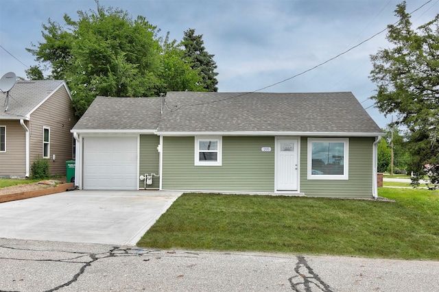 205 NW 51st Pl, Des Moines, IA 50313 - view of front of house featuring an attached garage, driveway, a shingled roof, and a front yard