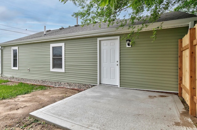205 NW 51st Pl, Des Moines, IA 50313 - rear view of property featuring a patio area and a shingled roof