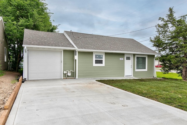 205 NW 51st Pl, Des Moines, IA 50313 - view of front of home with driveway, a garage, a front lawn, and a shingled roof