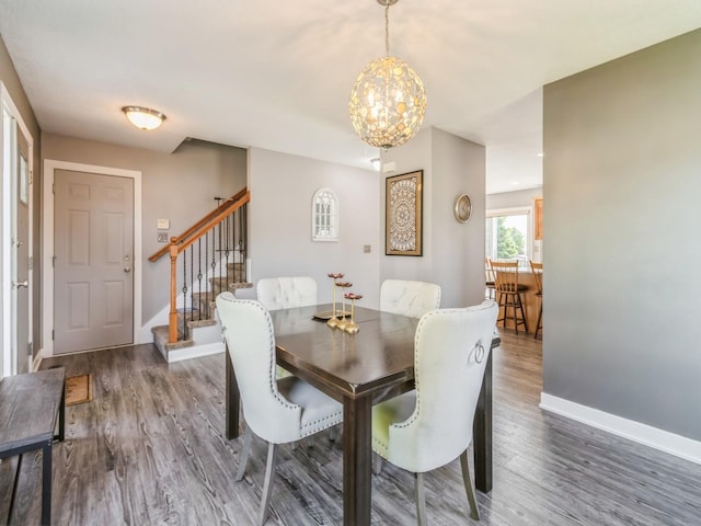 900 SE Woodbine Dr, Grimes, IA 50111 - dining space featuring stairway, wood finished floors, baseboards, and a chandelier