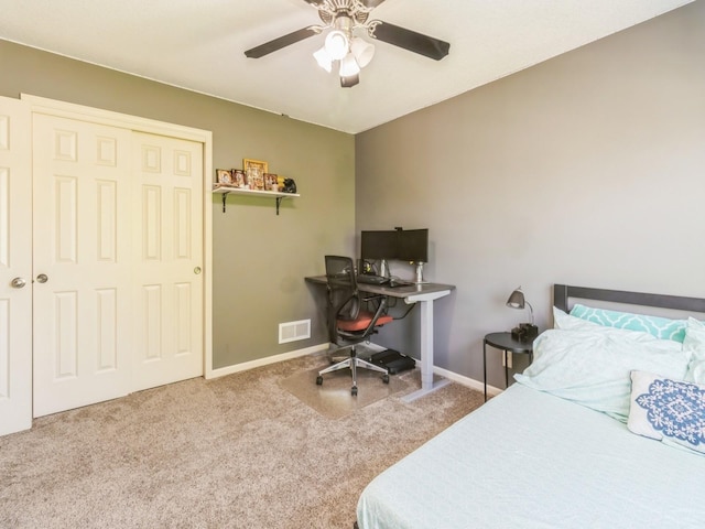 900 SE Woodbine Dr, Grimes, IA 50111 - bedroom featuring carpet floors, baseboards, ceiling fan, and a closet