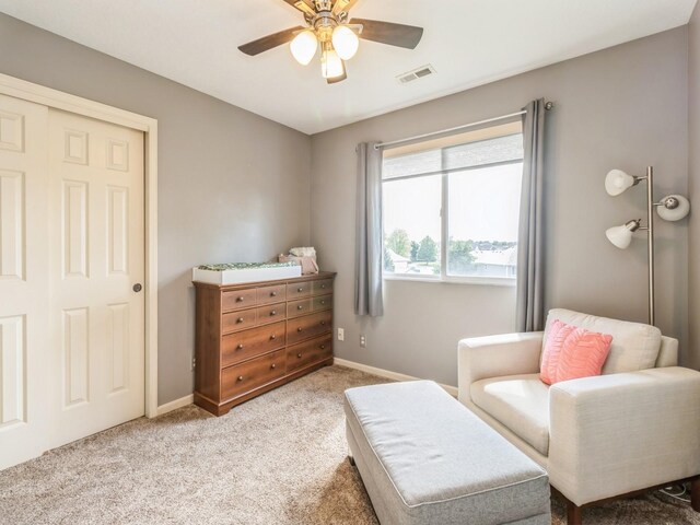 900 SE Woodbine Dr, Grimes, IA 50111 - living area with ceiling fan, carpet floors, and baseboards