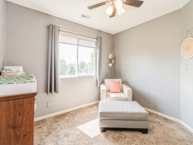 900 SE Woodbine Dr, Grimes, IA 50111 - living area featuring a ceiling fan, carpet floors, and baseboards