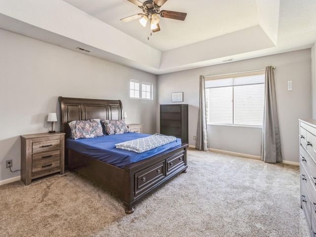 900 SE Woodbine Dr, Grimes, IA 50111 - bedroom featuring light colored carpet, a raised ceiling, baseboards, and a ceiling fan