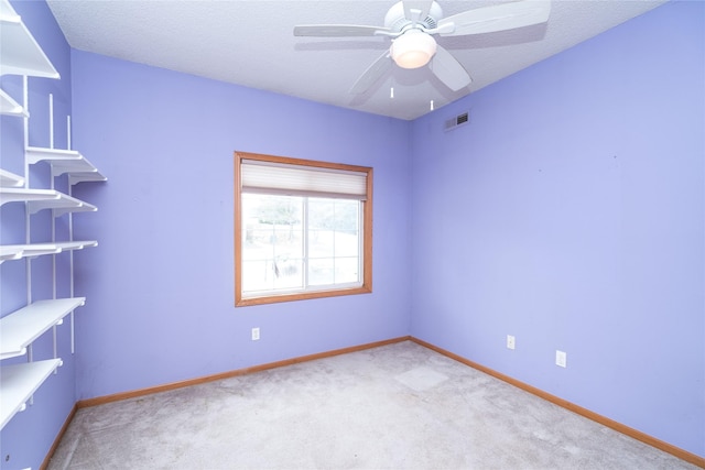2433 Patricia Dr Unit 24, Urbandale, IA 50322 - carpeted spare room with baseboards and a ceiling fan